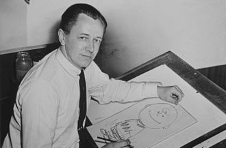 Charles Schulz drawing a cartoon